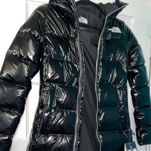 Adorable shiny black long coat. New with tags.